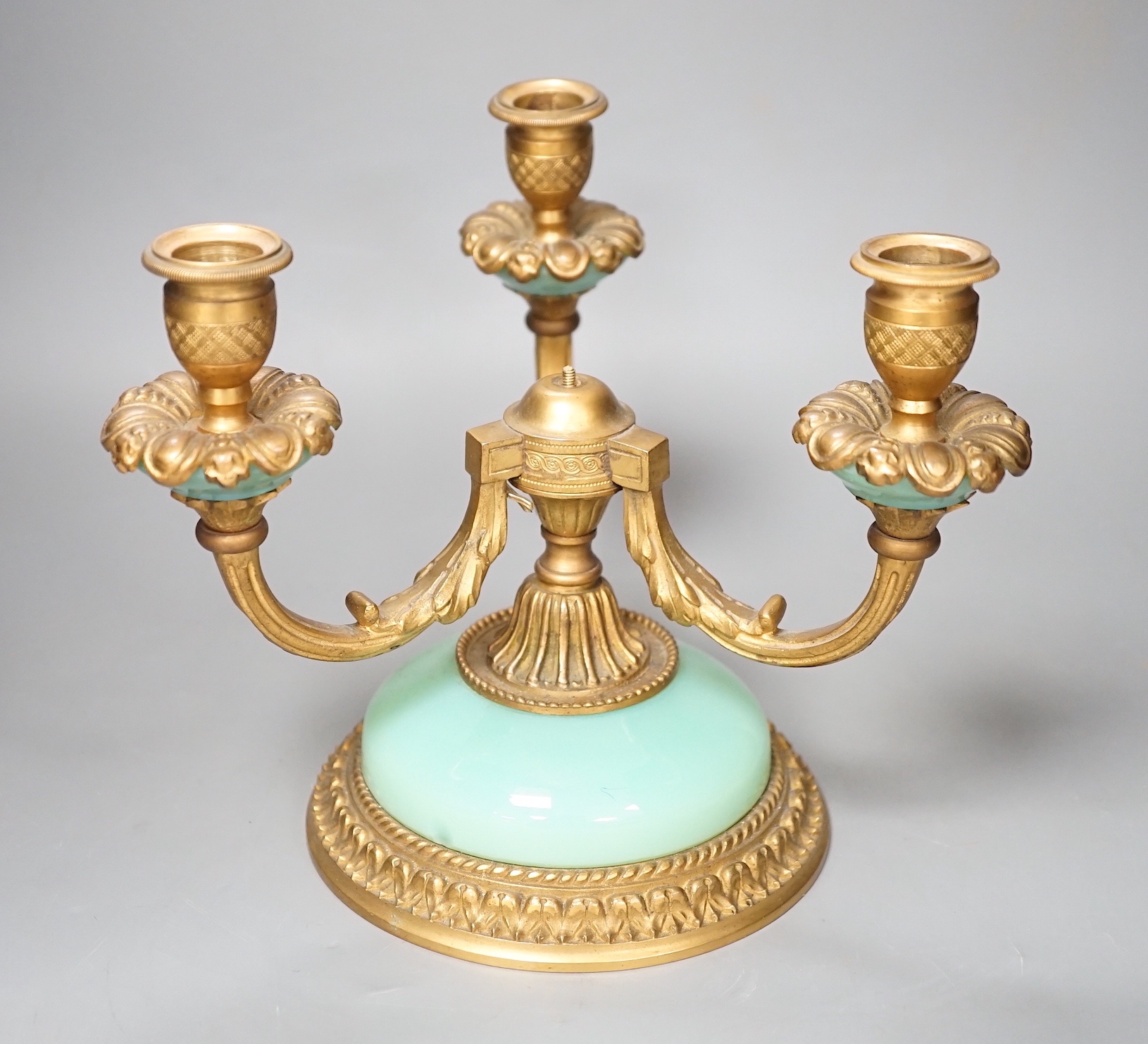 A three branch porcelain and ormolu mounted candelabrum, 19.5cm high